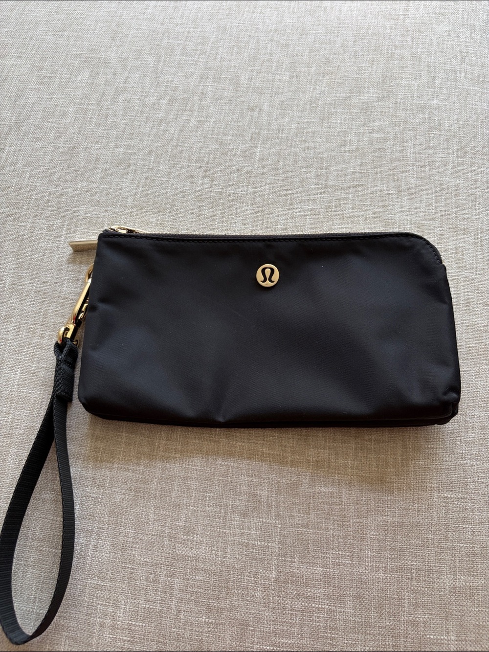 lululemon athletica Black Wristlet Pouch with Gold Emblem